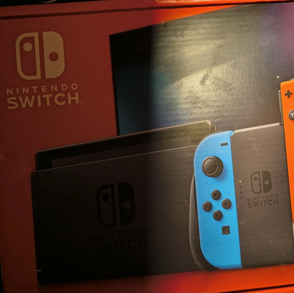 Nintendo Switch with Blue Left Joy‑Con and Orange Right Joy‑Con